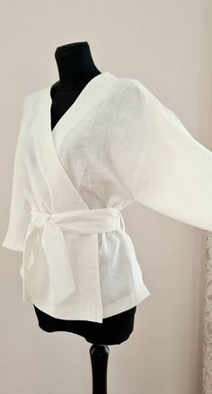 "White kimono blouse * long sleeves  * belt decorated with four  * loose blouse SIZE CHART: SIZE XS (mostly USA/CA-2, UK-4, AU/NZ-6, JAP-5, EU-32) Bust/Waist/Hips 80cm/60cm/88cm 31.5\"/25.2\"/34.5\" SIZE XS/S (mostly USA/CA-4, UK-6, AU/NZ-8, JAP-7, EU-34) Bust/Waist/Hips 84cm/64 cm/92cm 33\"/26.5\"/36.2\" SIZE S (mostly USA/CA-6, UK-8, AU/NZ-10, JAP-9, EU-36) Bust/Waist/Hips 88cm/68cm/96cm 34.5\"/28.5\"/37.7\" SIZE M (mostly USA/CA-8, UK-10, AU/NZ-12, JAP-11, EU-38) Bust/Waist/Hips 92cm/72cm/100cm 36.2\"/30\"/39.5\" SIZE L (mostly USA/CA-10, UK-12, AU/NZ-14, JAP-13, EU-40) Bust/Waist/Hips 96cm/76cm/104cm 37.7\"/31.5\"/41\" SIZE L/XL (mostly USA/CA-12, UK-14, AU/NZ-16, JAP-15, EU-42) Bust/Waist/Hips 100cm/80cm/108cm 39.5\"/33\"/42.5\" SIZE XL (mostly USA/CA-14, UK-16, AU/NZ-18, JAP-17, EU-4 Blouse Size Chart, Kimono Style Tops, Kimono Blouse, Kimono Shirt, White Blouse Top, White Kimono, Angel Outfit, Linen White, Style Blouse