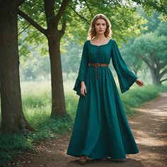 Bring yourself back to an ageless beauty in our Emerald  Medieval Dress, tailored specifically for the ladies mesmerized by the Renaissance era. This beautiful gown has been made from luxurious deep emerald fabric that catches the light with every step, epitomizing richness in historical fashion. This dress has a fitted bodice that is front-laced to provide a tailored fit at the natural waist, while the skirt flows gracefully to the ground to create a silhouette that's both regal and ethereal. P Green Medieval Dress Modern, Long Sleeve Fairycore Costume Dresses, Medieval Style Dress For Costume Party, Green Dress With Historical Design, Elven Medieval Dress With Fitted Bodice For Costume Party, Elven Dress With Fitted Bodice For Costume Party, Floor-length Medieval Dress For Fantasy Events, Medieval Floor-length Dress For Cosplay, Floor-length Elven Medieval Dress For Larp