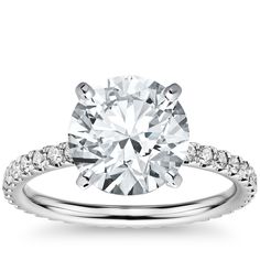 a diamond engagement ring with pave set shoulders