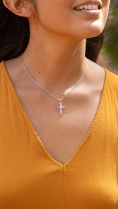 The Hawaiian Heirloom Cross Pendant features traditional Hawaiian scrollwork with maile leaves and a diamond at the center of the cross. The Hawaiian Heirloom Cross Pendant is a symbol of love, honor, and respect. Made in Hawaiʻi Etched Jewelry Gift, Engraved Adjustable Cross Pendant Jewelry, Adjustable Engraved Cross Pendant Jewelry, Engraved Crucifix Jewelry Gift, White Engraved Pendant Jewelry, Personalized Adjustable Cross Pendant Jewelry, Personalized Spiritual Crucifix Jewelry, Diamond Cut Crucifix Jewelry For Gift, Diamond Cut Crucifix Jewelry As Gift