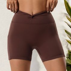 The Anna-Kaci Women's High Waist Ruched Front Biker Shorts offer a perfect combination of comfort and style for both activewear and casual settings. Designed with a flattering ruched front and high waist for a secure fit, these shorts provide excellent coverage and support. The seamless stretch fabric ensures flexibility and ease of movement, making them ideal for workouts or lounging. Featuring convenient side pockets for storing essentials, these biker shorts are versatile enough for pairing w Brown Stretch Mid-thigh Shorts, Brown Stretch Mid-thigh Length Shorts, Stretch Brown Mid-thigh Length Shorts, Brown Stretch Athletic Shorts, Stretch Brown Workout Shorts, Brown Stretch Workout Shorts, Brown Athletic Shorts With Built-in Stretch, Stretch Brown Sports Shorts, Brown Stretch Sports Shorts