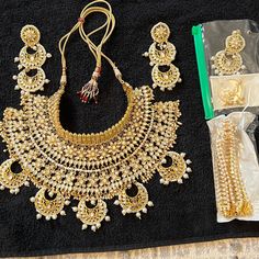 Designer Indian Bridal Set - Kundan Pearl Work 6 Pieces Set 1- Necklace 2- Earrings 3- Mang Tika ( Forehead Tiara) 4-5- 2 Nose Ring - With Pearls Chain 6- Anklets With Pearl Heavy In Weight In Excellent Condition Wore It Once Nothing Is Broken Or Lost In This Set. Look As Same As Pictures Forehead Tiara, Ethnic Indian Wear, Mang Tika, Pearl Work, 2 Earrings, Jewelry Indian, Earrings 3, Pearl Chain, Bridal Set