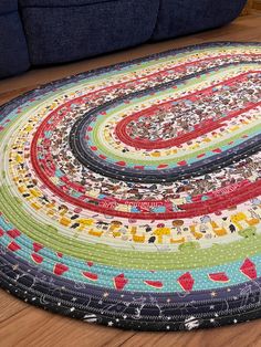 a multicolored round rug on the floor