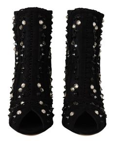 Step into luxury with these exquisite Dolce & Gabbana short boots, crafted to perfection with sparkling crystal embellishment. Meticulously designed for the fashion-conscious individual, they exude sophistication and high-end quality, essential for any elegant wardrobe. Constructed with a blend of durable nylon and supple leather, along with touches of viscose and polyester, these boots promise both unparalleled comfort and style. Proudly made in Italy, they feature the esteemed brand’s signatur Boots For Short Women, Crystal Heels, Zipper Shorts, Black Tulle, Dolce E Gabbana, Feminine Design, Leather Logo, Crystal Embellishment, Sparkling Crystal