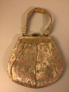 Vintage Graceline master purse 40,s 50's Brocade fabric evening purse .comes with original coin purse and mirror. Some rhinestone missing from the clasp . Hight 7 inches,length 7 inches at the center,strap 5 inches long. Pre owned good condition. Purse Vintage, Evening Purse, Class Projects, Vintage Purses, Brocade Fabric, Clutch Handbag, Evening Bags, Purses And Handbags, Cape