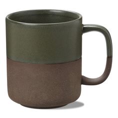 a green and brown coffee mug on a white background