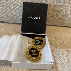 Authentic Chanel Clip On Earrings Never Worn. High-end Gold Earrings For Gift, Gold Jewelry For Anniversary In Original Box, Gold Jewelry For Anniversary With Original Box, Luxury Jewelry With Box For Anniversary, Luxury Jewelry For Anniversary With Box Included, Luxury Yellow Gold Earrings, Designer Jewelry Set With Earrings, Designer Black Earrings For Gift, Elegant Formal Jewelry With Original Box