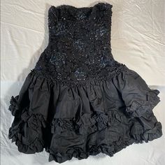 All Black, Top Portion Fits As A Corset [Structured] Black Bead And Sequin Design. Bottom Portion Is A Two Tiered With Ruffle Lining. Dry Clean Only* Size 6 Measurements- Bust: 13” Waist: 12” Hip: 16” Flare: 35” Strap To Hem: 29” Waist To Hem: 15” Vintage Corset Dress, Vintage Corset, Sequin Design, 1980s Vintage, Corset Dress, Couture Dresses, Black Top, Black Beads, All Black