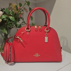 Color: Miami Red Style 2553 Crossgrain Leather Inside Zip Pocket Zip Closure, Fabric Lining Handles With 3 3/4" Drop Outside Zip Pocket Detachable Strap With 22" Drop For Shoulder Or Crossbody Wear 11 3/4" (L) X 7 3/4" (H) X 4" (W) Katy Satchel Red Satchel With Zipper Closure For Evening, Coach Red Satchel With Detachable Handle, Red Coach Satchel With Top Carry Handle, Elegant Red Satchel With Zipper Closure, Red Coach Satchel With Top Handle, Coach Red Satchel With Detachable Strap, Coach Red Satchel With Adjustable Strap, Red Coach Satchel With Adjustable Strap, Couch Bag