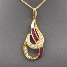 "Striking Luxe Natural Ruby and Diamond Pendant Necklace in 18k Yellow Gold This luxe pendant necklace makes a statement on any neckline!  The pendant hangs on an 18\" chain and features a double teardrop design, with natural square cut rubies that are channel set and natural diamonds which are prong set.  Stamped on the back of the pendant, the weights are 0.39cttw for the diamonds and 0.72cttw for the rubies, for a necklace total weight of 1.11cttw.  The diamonds are bright, F/G color and VS2 Fine Jewelry Teardrop Pendant Necklace, Fine Jewelry Teardrop Pendant Necklace With Detachable Feature, Fine Jewelry Necklace With Detachable Teardrop Pendant, Yellow Gold Necklace With Large Teardrop Pendant, Yellow Gold Teardrop Necklace With Large Pendant, Yellow Gold Teardrop Pendant Necklace With 17 Jewels, Channel Set, Square Cut, Diamond Pendant Necklace