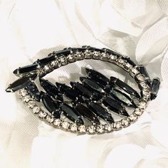 Vintage Black Glass And Rhinestone Silver Tone Brooch is absolutely a stunning Brooch there are no missing rhinestones none of the black glass is cracked or broken it measures 2 1/2 inches width and 1 1/2 inches length can be worn either way Glamorous Formal Brooches With Rhinestones, Black Brooch Jewelry For Wedding, Black Rhinestones Brooch For Gift, Black Brooch Jewelry For Party, Black Party Jewelry Brooch, Glamorous Crystal Brooches For Evening, Glamorous Evening Crystal Brooches, Elegant Party Brooches With Sparkling Stones, Onyx Cufflinks