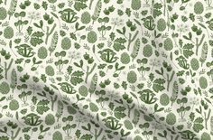 a green and white floral print fabric with small flowers on it, as well as the measurements