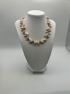 If you're in search of a timeless necklace, your search ends here. Consider the everlasting elegance of pearls - ideal for every occasion, be it anniversaries, weddings, formal events, a spring afternoon ensemble, or a night out. This particular piece promises to surpass your expectations. This necklace is an exquisite composition of delicate blush tones and creamy whites, designed to add a touch of feminine elegance to any outfit. It features an array of pearls and semi-precious stones in soft Classic Pearl-embellished Necklace For Parties, Elegant Polished Pearl Necklace For Anniversary, Classic Pearl Embellished Necklaces For Party, Formal Pearl Necklace With Polished Beads, Elegant Necklace With Pearl Drop And Round Beads, Elegant Pearl Necklace With Polished Beads As Gift, Classic Polished Pearl Necklace For Wedding, Wedding Akoya Pearl Beaded Necklaces With Pearl Charm, Single Strand Pearl Jewelry For Party