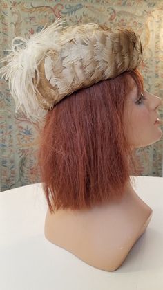 This exquisite feather hat, styled by "the doyenne of the millinery industry" herself - Ann Albrizio -  is in excellent vintage condition: I can find no flaws.  The interior is camel felt.  It is interesting to note that each Albrizio creation was - and still is - made by hand in their Brooklyn factory using the millinery technique of hand-blocking over wooden hat moulds. What a wonderful example of 1950s glam style at its best! This creation would certainly enhance - or be the focal point of - Vintage Feathered Headpieces For Vintage Events, Vintage Feather Headpieces For Vintage Events, Formal Hat With Feather Trim, Formal Costume Hats With Feather Trim, Formal Costume Hats And Headpieces With Feather Trim, Vintage Evening Fascinator With Feathers, Vintage Feathered Costume Hats For Evening, Vintage Feathered Costume Hats And Headpieces For Evening, Vintage Feathered Hats