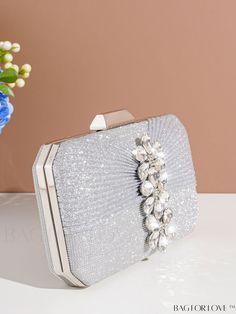 BagForLove - Deluxe Wedding Clutch with Diamond-styled Decoration - Versatile and Elegant Evening Bag Product Description Color Silver Details Rhinestone Magnetic No Strap Type Chain Bag Size Mini Style Glamorous Pattern Type Plain Type Square Bag Closure Type Kiss Lock Material Glitter Composition 100% Polyester Care Instructions Do not wash Size Chart INCH CM Bag Height Bag Length Bag Width Strap Length 4.7 inch 7.9 inch 2.2 inch 47.2 inch Bag Height Bag Length Bag Width Strap Length 12 cm 20 cm 5.5 cm 120 cm Details Pictures Similar Products h2 { text-align: center; } /* æ¢è¡ */ li{ white-space: normal; word-break: break-all; word-wrap: break-word; } .red-box { width: 100%; display: flex; flex-direction: row; flex-wrap: wrap; justify-content: center; } .red-box > div { width: 190px; h Glamorous Silver Bag For Wedding Guest, Silver Clutch Bag For Wedding Guest, Silver Pouch Evening Bag For Wedding, Glamorous Wedding Pouch Bag, Rectangular Wedding Bags With Rhinestones, Silver Clutch Shoulder Bag For Wedding, Embellished Silver Bags For Wedding, Silver Wedding Clutch Shoulder Bag, Silver Rectangular Clutch For Wedding Guest