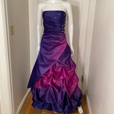 Stunning Ball Gown With Rhinestone Embellishments. Side Zipper. New Without Tags. All Sales Final Purple Ball Gown With Fitted Bodice For Prom, Purple Gown For Prom Season, Purple Dress With Fitted Bodice For Debutante Ball, Purple Evening Dress With Sweep Train For Prom, Purple Gown With Fitted Bodice For Prom, Purple Ball Gown With Fitted Bodice, Purple Sweep Train Dress For Prom Season, Purple Dresses With Sweep Train For Prom Season, Purple Dresses With Sweep Train For Prom