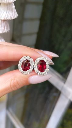 If you want to give someone special something truly unique, then these ruby diamond earrings are a great choice. They will become an unforgettable gift that will be appreciated for many years. And if you want to buy them for yourself, then these earrings will be a great addition to any outfit. They will emphasize your personality and style. You will feel special and confident wearing these jewelry! Luxury Red Brilliant Cut Earrings, Luxury Oval Gia Certified Earrings, Gia Certified Oval Diamond Earrings, Luxury Oval Ruby Earrings, Red Brilliant Cut Fine Jewelry Earrings, Luxury Red Oval Earrings, Red Oval Wedding Earrings, Oval Ruby Earrings For Wedding, Oval Ruby Earrings With Halo Design