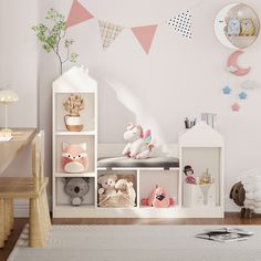 a child's room with pink and white decor