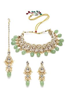 This jewelry set consists of a necklace, a pair of earrings The gold-plated necklace, has lime green stone and white kundan studded detail Secured with a drawstring closure A pair of matching drop earrings, each secured with post and back closure Comes with matching maang tikka Size & Fit Dimensions: Necklace: 23cm x 2.5cm (Length x Width) Earrings: 7cm x 2.5cm (Length x Width) Maangtikka: 7cm(Length) Material & Care Material: Alloy Plating: Gold-Plated Stone Type: Kundan Wipe with a clean cotton swab when needed Luxury Green Jewelry Sets For Festivals, Luxury Tilla Jewelry Sets, Luxury Pista Green Cutdana Set, Luxury Green Cutdana Jewelry Sets, Luxury Green Ceremonial Jewelry, Luxury Green Bollywood Sets, Luxury Green Temple Necklace With Meenakari, Luxury Green Necklace For Festivals, Luxury Green Bollywood Jewelry Sets