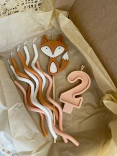 the cake toppers are made to look like animals and letters with tails on them