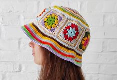 "Granny square bucket hat is MADE TO ORDER This is fully handmade uniq sun hat. Crochet colorful hat is beautiful and comfortable summer accessory. Rainbow festival hat looks so gorgeous! Unisex sun hat in bohemian style is excellent protection against the scorching sun.  One size - head circumference from 21\" / 55 cm to 22.5\" / 59 cm Yarn: 50% cotton, 50% acrylic Care: machine washing is allowed іn cold water (max. 86ºF / 30ºC). Do not wring or twist. Do not bleach. Do not tumble dry. Thank y Retro Sun Hat For Summer Festival, Retro Crochet Summer Hat For Vacation, Beach Crochet Bucket Hat With Granny Square, Beach Bucket Hat With Granny Square Crochet, Retro Crochet Bucket Hat For Vacation, Handmade Retro Crochet Hat For Vacation, Handmade Retro Crochet Hat For Summer, Summer Retro Crochet Bucket Hat, Granny Square Crochet Bucket Hat For Beach