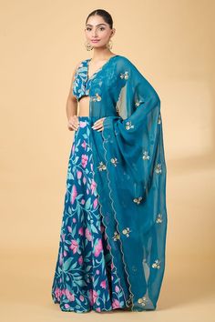 Teal blue scallop bordered blouse with floral print and aari, zardosi embroidery. Paired with coordinating lehenga and scallop hem dupatta. - Aza Fashions Blue Bollywood Lehenga With Floral Print, Blue Anarkali Lehenga With Floral Print, Traditional Blue Lehenga With Floral Print, Traditional Blue Floral Print Lehenga, Blue Floral Print Choli For Festive Occasions, Festive Blue Floral Print Choli, Blue Floral Print Wedding Sets, Blue Floral Print Anarkali Set For Wedding, Designer Blue Floral Print Dupatta