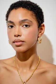 Cuff It! Simple elegance meets playful design with these gold huggie hoops. Whether you’re thinking about cuffing szn or the more literal meaning of handcuffs, take these earrings as you please. The click closure means you never have to take these off, and they can stay secure during all forms of activity. The fun handcuff style is a cheeky nod to the bedroom and can make the perfect gift for treating yourself or surprising your special someone. Within The Date Night collection you can find the perfect gift for your girlfriend including versatile jewelry with twists and winks to the bedroom or mark anniversaries with jewellery gifts dripping in sentimental value. Material: 18k gold plated brass and cubic zirconia Gold Hypoallergenic Small Hoop Ear Cuff, Tarnish Resistant Gold-plated Hoop Ear Cuff, Interlocking Bold Hoop Earrings, Jelly Hearts, Luxury Modern Hoop Earrings With Gold-tone Hardware, Cuffing Season, Luxury Tarnish-resistant Brass Hoop Earrings, The Click, Talisman Jewelry