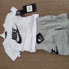 Very Cute 12 Month Size Two Piece Set. Nike Emblem On T-Shirt And Shorts. Nwt Nike Casual Cotton Sets, Nike Casual Crew Neck Sets, Casual Nike Cotton Sets, Casual Cotton Nike Sets, White Cotton Short Set For Spring, Nike Sets With Letter Print And Short Sleeve, Spring White Cotton Short Set, White Letter Print Crew Neck Sets, White Sporty Crew Neck Sets