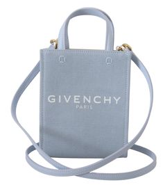 Sophistication meets style with this 100% Authentic Givenchy top handle bag. The stunning cloud blue mini bag is your perfect companion for a touch of luxury on any occasion. Crafted from the finest cotton, it combines elegance with practicality, boasting a sleek vertical rectangle design. Whether it’s a day out or an elegant evening affair, this Made in Italy masterpiece is an impeccable choice with its easy-to-style color and premium logo details. Completed with a comfortable strap for shoulder wear, it’s a statement piece that speaks volumes about your impeccable fashion sense. Material: 100% Cotton Color: Blue Country of origin: SE Measurements: 17cm x 13.5cm x 6cm Strap: 115cm Model Shoulder, Givenchy Top, Color Cloud, Dolce And Gabbana Blue, Bag Model, Givenchy Women, Mini Shoulder Bag, Brand Store, Cotton Logo