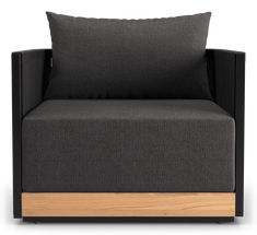 a black and wood chair with two pillows on it