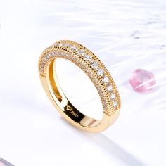 Celebrate your everlasting love story with three sided pave band. Stunning as a wedding or anniversary band, this exquisite style is lovely alone or paired with engagement ring. Buffed to a brilliant luster, this ring is a beautiful reminder of your timeless romance.Carat Weight: 1.454 ctStone Size: 1,1.1,1.2,1.3,1.4,1.8 mmStone Type: Jeulia® StoneNumber of Stones: 58 Stone Color: Diamond WhiteStone Shape: RoundWeight: 3.78 gWidth: 3.25 mmHeight: 2.97 mmThickness: 3.25 mmMaterial: 925 SilverPlating Color: Yellow Gold