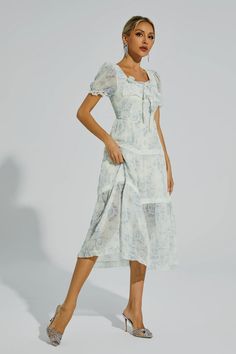 Elevate your summer wardrobe with the Frank White Flower Printed Midi Dress. This dress exudes sweet and feminine vacation vibes. Crafted from delicate chiffon, it features a beautiful blue floral print that adds a touch of elegance. Perfect for both casual outings and special occasions, this long dress will make you look effortlessly chic and stylish.  Dress Length: Approx 121cm Materials: Polyester Gentle Dry Clean Only  The model is 5 ft 7 and wears size S  Color may vary due to lighting on i Feminine Floral Chiffon Dress For Vacation, Feminine Chiffon Floral Dress For Vacation, Vacation Chiffon Floral Midi Dress, Light Blue Floral Dress For Summer, Elegant Ditsy Floral Print Dress For Vacation, Elegant Summer Floral Dress For Daywear, Elegant Floral Dress With Ditsy Print For Vacation, Light Blue Summer Floral Dress For Vacation, Summer Airy Chiffon Dress