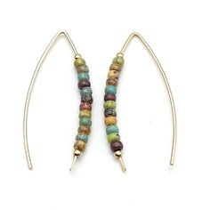 These handmade gold threader earrings are sure to turn heads! Featuring 14 karat gold-filled metal and colorful Miyuki seed beads, these minimal boho-style baubles offer perfect balance between subtle and show-stopping. Dress up your look in simply stunning style! Approximately 1.5" long Earrings are made from 14 karat Gold Filled wire and quality Miyuki Seed Beads Polished to a high shine Choice of earring packaging with fun quotes! (Picture 3) Gold-filled pieces have the same appearance as hig Bohemian 14k Gold-filled Jewelry With Colorful Beads, Bohemian 14k Gold-filled Beaded Earrings, Bohemian 14k Gold Filled Round Beaded Earrings, Everyday Bohemian Jewelry With Gold Beads, Handmade Minimalist 14k Gold Filled Threader Earrings, Minimalist Handmade 14k Gold Filled Threader Earrings, Bohemian Beaded 14k Gold Filled Earrings, Bohemian 14k Gold Filled Earrings With Tiny Beads, Bohemian 14k Gold Filled Beaded Earrings