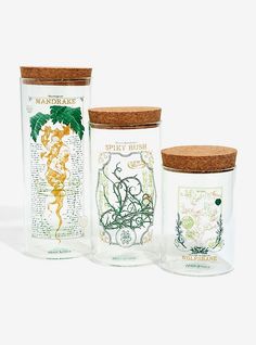 three glass jars with cork lids and labels