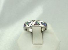 "Stunning opal inlay in this vintage sterling silver ring. Stamped \"925\". A nice addition to your personal jewelry collection. FREE SHIPPING! Details: Sterling Silver (shown in picture) Opal: inlay Ring Size: 7 3/4 Total Weight: 5.1 grams FREE Domestic Shipping by USPS Priority Mail Delivery Confirmation and includes insurance. If the item is to be shipped internationally Etsy will calculate postage. Please notify us at time of purchase if you are buying more than one item and we will gladly c Inlay Jewelry Yourgreatfinds ♥ Vintage Jewelry, Silver Opal Ring With Inlay For Anniversary, Anniversary Silver Opal Ring With Inlay, Vintage Silver Multi-stone Opal Ring, Ctr Rings, Personal Jewelry, Vintage Sterling Silver Rings, Mail Delivery, Purple Band