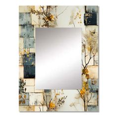 a mirror that is sitting on top of a tile wall with flowers and leaves in it