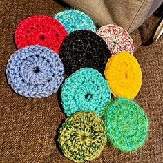 several crocheted donuts are sitting on the floor