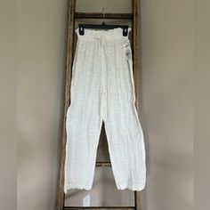 Hit The Beach And Elevate Your Casual Style With These Daily Habit Pants In A Beautiful Ivory Color. The Pants Are Made Of Lightweight Rayon Material And Feature An Elastic Waistband For Comfortable Wear. The Pull-On Closure And Regular Fit Make Them Easy To Wear And Perfect For Summer. The Pants Come In Size M And Have A Solid Pattern That Adds A Touch Of Bohemian Theme To Your Outfit. They Are Not Vintage, Handmade Or Personalized And Are Suitable For Regular-Sized Women. These Pants Are A Gre White High Waist Harem Pants For Vacation, Casual White Harem Pants With Elastic Waistband, White Casual Harem Pants With Elastic Waistband, White Harem Pants With Elastic Waistband For Spring, White High-waisted Relaxed Fit Harem Pants, White Harem Pants With Elastic Waistband For Vacation, White Ankle-length Harem Pants For Vacation, White Relaxed Fit Harem Pants For Beach, Cream Wide Leg Cotton Pants With Elastic Waistband