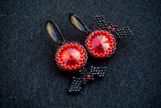 This earrings was made from black japanese MIYUKI and shimmer red glass crystals These earrings can be a great gift for your family and friends for the Halloween holiday. Also you can buy them for yourself on Halloween as an addition to your costume or separately as decorations for creating a festive mood. Available in a different color, just contact me All products are 100% hand made, made with love especially for you Please note that due to lighting effects, monitor's brightness, contrast and Red Drop Earrings For Halloween, Handmade Black Vampire Earrings, Red Earrings As Halloween Gift, Red Earrings For Halloween Gift, Handmade Red Crystal Earrings For Gift, Handmade Red Evening Earrings, Handmade Black Crystal Earrings For Party, Bright Jewelry, Black Japanese