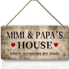 a sign that says mimi & papa's house where memories are made on it