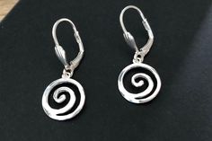 Sterling Silver Swirl Leverback Charm Earrings - I made the earrings with .925 Sterling Silver 14mm Swirl Charms.  The earrings hang from Leverback style earrings. Lightweight, everyday modern, minimalist earrings The earrings measure 30mm long from the top of the leverback earring, the swirl spiral charms measure approximately 14mm I will send your earrings wrapped in crisp white tissue paper and include a Mairi Jewellery branded gift box. Nickel Free Silver Swirl Earrings, Sterling Silver Swirl Earrings For Gift, Swirl Shaped Sterling Silver Earrings For Gifts, Swirl-shaped Pierced Earrings For Gift, Hypoallergenic Sterling Silver Swirl Earrings, Adjustable Spiral Sterling Silver Earrings, Spiral Sterling Silver Earrings For Anniversary, Spiral Sterling Silver Pierced Earrings, Sterling Silver Spiral Earrings For Anniversary