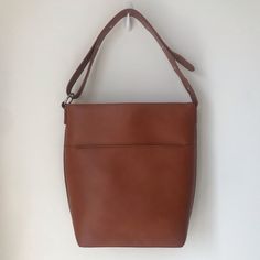 Brand New With Tag! Vegan Leather! Adjustable Strap! Versatile Brown Bucket Bag For On-the-go, Cognac Bucket Bag For On-the-go, Classic Brown Bucket Bag For On-the-go, Brown Bucket Bag With Adjustable Strap For Daily Use, Brown Rectangular Bucket Bag With Adjustable Strap, Everyday Cognac Bucket Bag With Detachable Strap, Brown Hobo Bag With Detachable Strap For Daily Use, Classic Brown Bucket Bag With Double Handle, Cognac Bucket Bag With Removable Pouch For Everyday Use