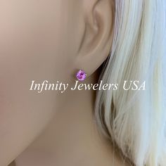 "The stud earrings pictured are lab created pink sapphire #6435 -Approximate total carat weight: 1.00ctw diamond equivalent -Stone Size:5mm - approx. 0.50ct each diamond equivalent -Stone Shape: round -Gem Type: lab created sapphire -Stone Clarity: VS2 -Stone Color: Pink -Moh's Scale: 9 hardness -Metal Type and Purity: 14k white gold -Setting: 4 prong basket head -Stock backings: screw back (earring backs are subject to change due to availability) -Country of Manufacturing: USA (Michigan) For cu Pink Oval Earrings With Prong Setting, Gia Certified Classic Pink Sapphire Jewelry, Classic Gia Certified Pink Sapphire Jewelry, Pink Brilliant Cut Earrings In Fine Jewelry Style, Pink Gia Certified Jewelry, Elegant Pink Sapphire Earrings With Prong Setting, Classic Pink Sterling Silver Earrings, Pink Prong Set Earrings For Anniversary, Pink Earrings With Prong Setting For Anniversary