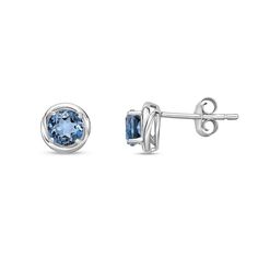 Top off your casual attire with a pop of vibrant color when you wear these round blue topaz swirl frame stud earrings in silver. Created in sterling silver Each earring showcases sculpted swirling ribbons highlighting the 5.0mm London blue topaz center stone. These post earrings secure comfortably with friction backs. Casual Attire, London Blue Topaz, London Blue, Sterling Silver Earrings Studs, Blue Topaz, Post Earrings, Sterling Silver Earrings, Topaz, Swirl