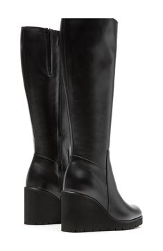 A subtle platform and wedge heel lift a knee-high leather boot crafted with City Dry technology that ensures you stay warm and dry through the cooler seasons. Waterproof: protects against rain, puddles and slush to keep feet dry in wet conditions 3 1/2" heel; 1" platform 14 1/4" shaft; 13 1/2" calf circumference Memory foam cushioning with arch support XL EXTRALIGHT® sole is lightweight, flexible and shock absorbent Leather upper/textile lining/rubber sole Made in Canada Black Knee High Wedge Boots, Modern Black High Shaft Boots, Leather Knee-high Wedge Boots For Work, Black Leather Mid-calf Tall Boots, Leather Wedge Boots With Block Heel, Black Tall Wide Calf Platform Boots, Black Tall Platform Boots With Wide Calf, Black Leather Knee-high Boots, Black Tall Boots With Stacked Heel