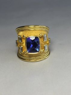 Luxury Collectible Sapphire Ring, Elegant Gold Sapphire Ring With Stone Setting, Luxury Gold Sapphire Ring With Accent Stones, Elegant Wide Band Collectible Jewelry, Handmade Luxury Gold Sapphire Ring, Collectible Elegant Wide Band Jewelry, Velvet Background, Cushion Cut Diamond Ring, Bold Rings