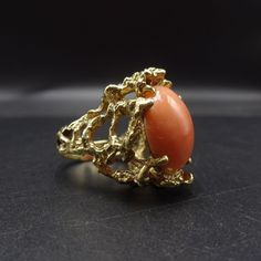 "ESTATE 14 KARAT GOLD and SALMON CORAL RING DESCRIPTION: This elegant ring features a large cabochon of pink salmon coral, placed in an organic setting of heavy gauge 14 karat yellow gold. This ring will be a valuable addition to your collection of fine vintage jewelry. MEASUREMENTS: Ring face measures 1\" north to south RING SIZE: 6 Domed coral cabochon measures 18mm x 13mm x 7mm WEIGHT: 15.9 grams SIGNED: no GOLD: Marked 14K" Formal Coral Jewelry With Cabochon Details, Formal Coral Jewelry With Cabochon, Oval Coral Cabochon Jewelry, Coral Oval Cabochon Jewelry, Formal Coral Ring, Formal Coral Oval Jewelry, Jewelry Measurements, Turquoise Men, Coral Ring