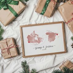 presents are wrapped in brown paper and tied with twine on top of a white sheet