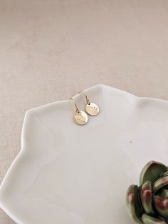 "Elevate your seasonal style with these 100% 14k gold filled asymmetrical leaf earrings. Available in both 10mm and 13mm sizes, these nature-inspired pieces add a touch of minimalist elegance. Choose between 14k gold filled French hooks or sleek lever-back ear wires for added comfort and security. * Tiny 10mm (3/8\") discs OR * Small 13mm (1/2\") discs * 100% 14k YELLOW gold-filled (includes ear wires!) * French hook ear wires with tiny ball at the top with rubber stoppers (Or lever backs) SILVE Simple 14k Gold Drop Earrings, Minimalist Hypoallergenic Earrings In Recycled Gold, Minimalist Hypoallergenic Recycled Gold Earrings, Nickel Free Minimalist 14k Gold Filled Earrings, Dainty Gold Earrings Gift For Her, Minimalist Everyday Earrings In Recycled Gold, Simple 14k Gold Filled Drop Earrings, Everyday Minimalist Earrings In Recycled Gold, Dainty 14k Yellow Gold-filled Earrings