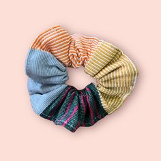 These beautiful scrunchies are a beautiful addition to your next look. Unique, handwoven and will perfectly suit all your outfits and days, making your style and personality shine bright with the charming Guatemalan flair. Comes in sets of three, including three different colors. This product is created using previously worn and well-loved Maya textiles since reworked. Reintroducing otherwise discarded fabric is a part of Trama Textile’s dedication to slow fashion and sustainability. Purchasing Handmade Multicolor Hair Accessories For Gift, Trendy Multicolor Hair Accessories As Gift, Trendy Multicolor Hair Accessories For Gift, Multicolor Spring Hair Accessories Gift, Multicolor Spring Hair Accessories For Gift, Multicolor Hair Accessories For Spring Gift, Beautiful Scrunchies, Guatemalan Textiles, Backstrap Loom